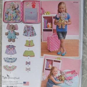 May include: Simplicity pattern 1238 featuring a stuffed elephant toy and various clothing pieces. The pattern includes a suitcase-shaped carrying case and a photo of a child with the elephant toy. The pattern is designed and printed in the USA.