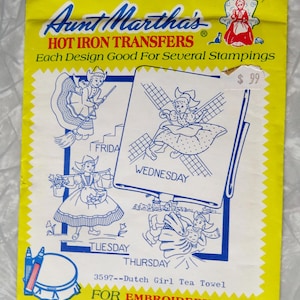 May include: A vintage Aunt Martha's Hot Iron Transfers packet. The cover is yellow with a red border and features illustrations of Dutch girls. The packet includes designs for embroidery, fabric painting, and other crafts. The price tag reads &pound;99.