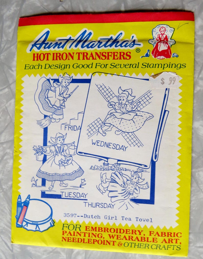 May include: A vintage Aunt Martha's Hot Iron Transfers packet. The cover is yellow with a red border and features illustrations of Dutch girls. The packet includes designs for embroidery, fabric painting, and other crafts. The price tag reads &pound;99.