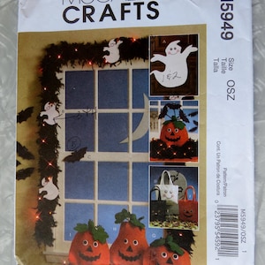 May include: A sewing pattern for Halloween crafts, featuring a window with a garland of lights and bats, a pumpkin, a ghost, and a trick-or-treat bag. The pattern number is M5949 and the size is OSZ.