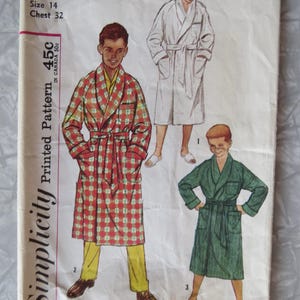 May include: Simplicity Printed Pattern 45c, sewing pattern for a robe, size 14, chest 32. The pattern shows three boys wearing different robes: one in white, one in red and white plaid, and one in green.