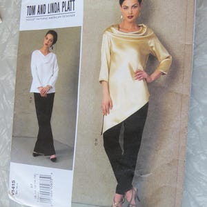 May include: Vogue pattern V1415 by Tom and Linda Platt. The pattern features a woman wearing a gold-colored satin top with black pants. The pattern also shows a woman wearing a white top with black pants. The text "TOM AND LINDA PLATT" is visible.