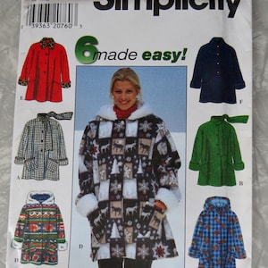 May include: A Simplicity sewing pattern envelope 7803 for a jacket in sizes L and XL. The cover displays six variations of the jacket, including a red coat with leopard print trim, a green coat with a scarf, and a winter-themed coat with reindeer.