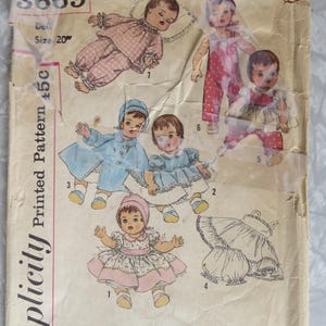 May include: Vintage Simplicity doll pattern featuring illustrations of dolls in various outfits. The pattern includes images of dolls in dresses, rompers, and coats. The pattern size is 20 inches. The pattern is printed and includes the number 3669.