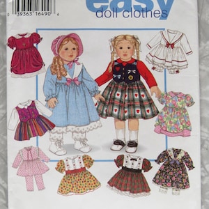 May include: Simplicity pattern for designing doll clothes. The package features illustrations of various doll outfits, including dresses and a jacket-and-pants set. The text "design your own easy doll clothes" is visible.