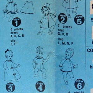 May include: A blue and white sewing pattern for a doll's dress, coat, romper, nightgown, top, and pants. The pattern includes six different views, each with a different outfit. The pattern is labeled with the number of pieces needed for each outfit.
