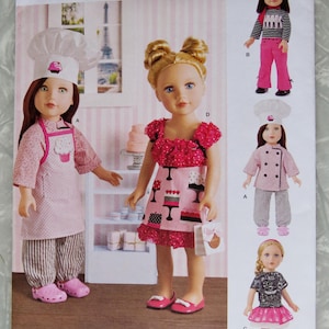 May include: Simplicity pattern 8315 for doll clothes. The pattern includes outfits for 18-inch dolls, featuring a chef's outfit, a striped shirt and pink pants, and a black shirt with a pink skirt. The pattern is designed and printed in the USA.