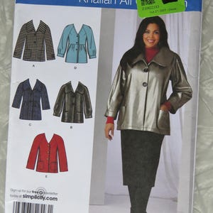 May include: A Simplicity sewing pattern envelope 2543 for Khaliah Ali designs, featuring illustrations of five jacket variations labeled A through E. The package displays size range AA 10-18 and includes a barcode and the website simplicity.com.