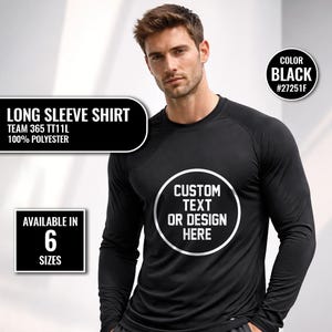 Op de afbeelding: Zwart shirt met lange mouwen en een ronde hals. Het shirt heeft een witte cirkel met de tekst "CUSTOM TEXT OR DESIGN HERE". Het shirt is gemaakt van 100% polyester en is verkrijgbaar in 6 maten. De kleur is zwart, code #27251F.