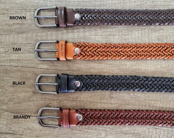 May include: Four braided leather belts in brown, tan, black, and brandy colors. Each belt has a silver buckle with the word "LEATHERINGS" engraved on it.
