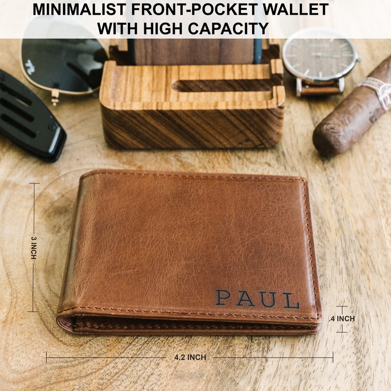 May include: A brown leather wallet with the name "PAUL" embossed on the front. The wallet measures 4.2 inches wide, 3 inches tall, and 0.4 inches thick.