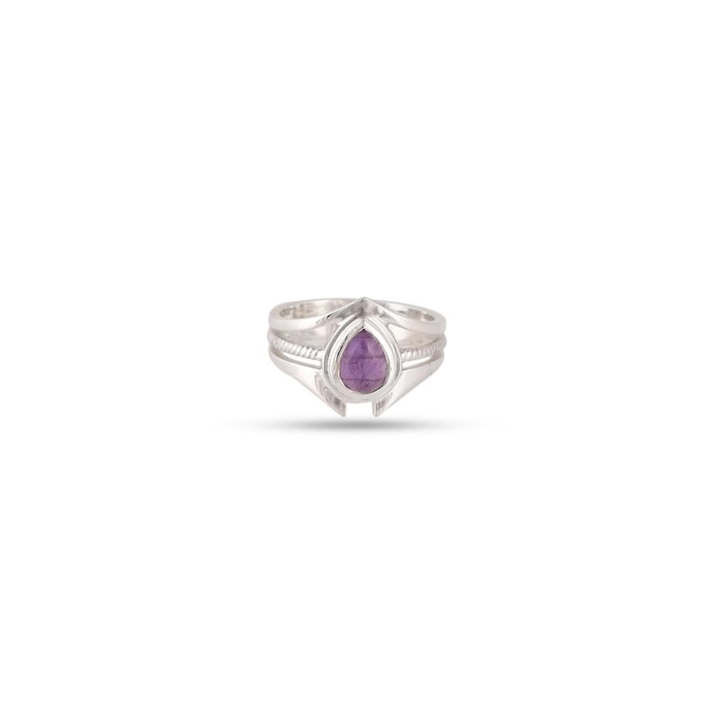 May include: A silver ring with a teardrop-shaped amethyst gemstone set in the centre.