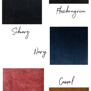 Op de afbeelding: Een close-up van zes stofstalen in verschillende kleuren. De stalen zijn gerangschikt in twee rijen van drie. De kleuren zijn zwart, flessengroen, marineblauw, roestbruin en camel.