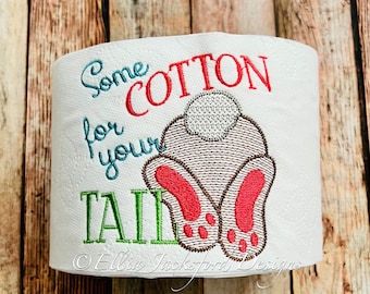 May include: White toilet paper roll with embroidered text "Some Cotton for your Tail" and a brown bunny rabbit with a white tail and pink feet.