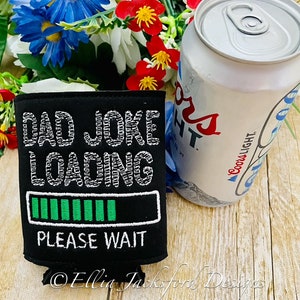 May include: Black and green can cooler with the text "Dad Joke Loading" and a progress bar. The progress bar is green and almost full. The text "Please Wait" is below the progress bar.