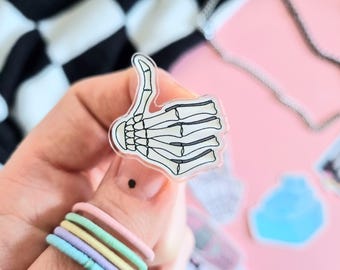 Pin acrílico de mano de esqueleto / Insignia de pulgar hacia arriba/abajo