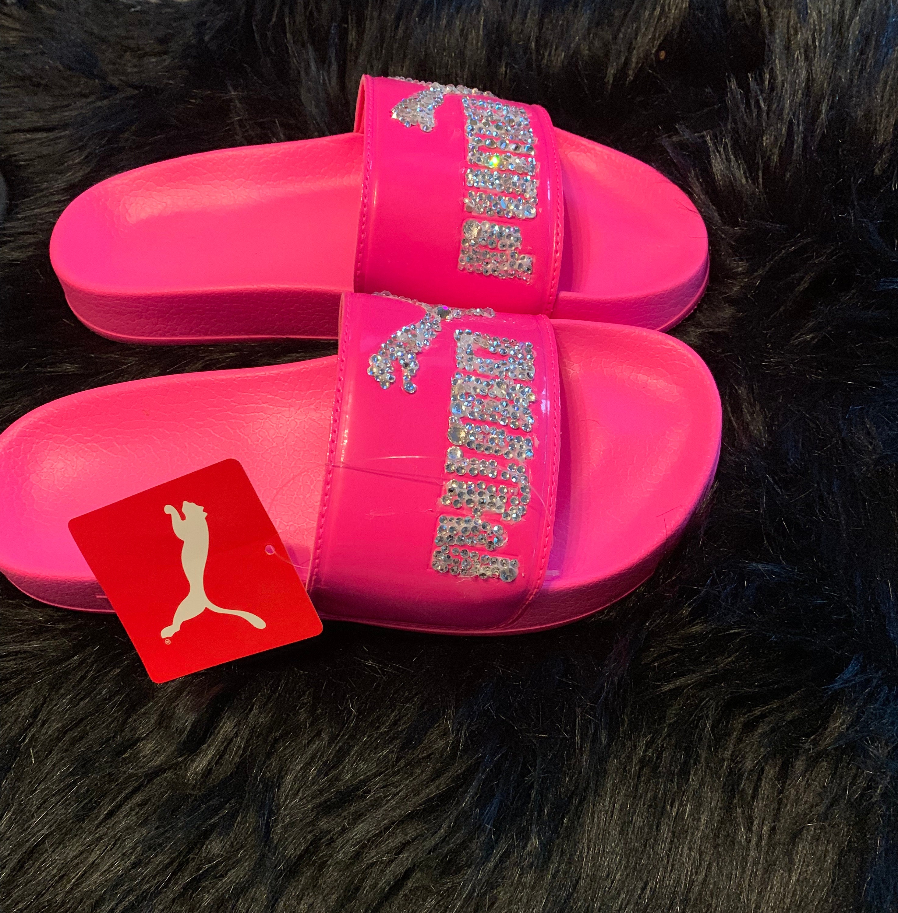 Fuzzy pink best sale puma slides