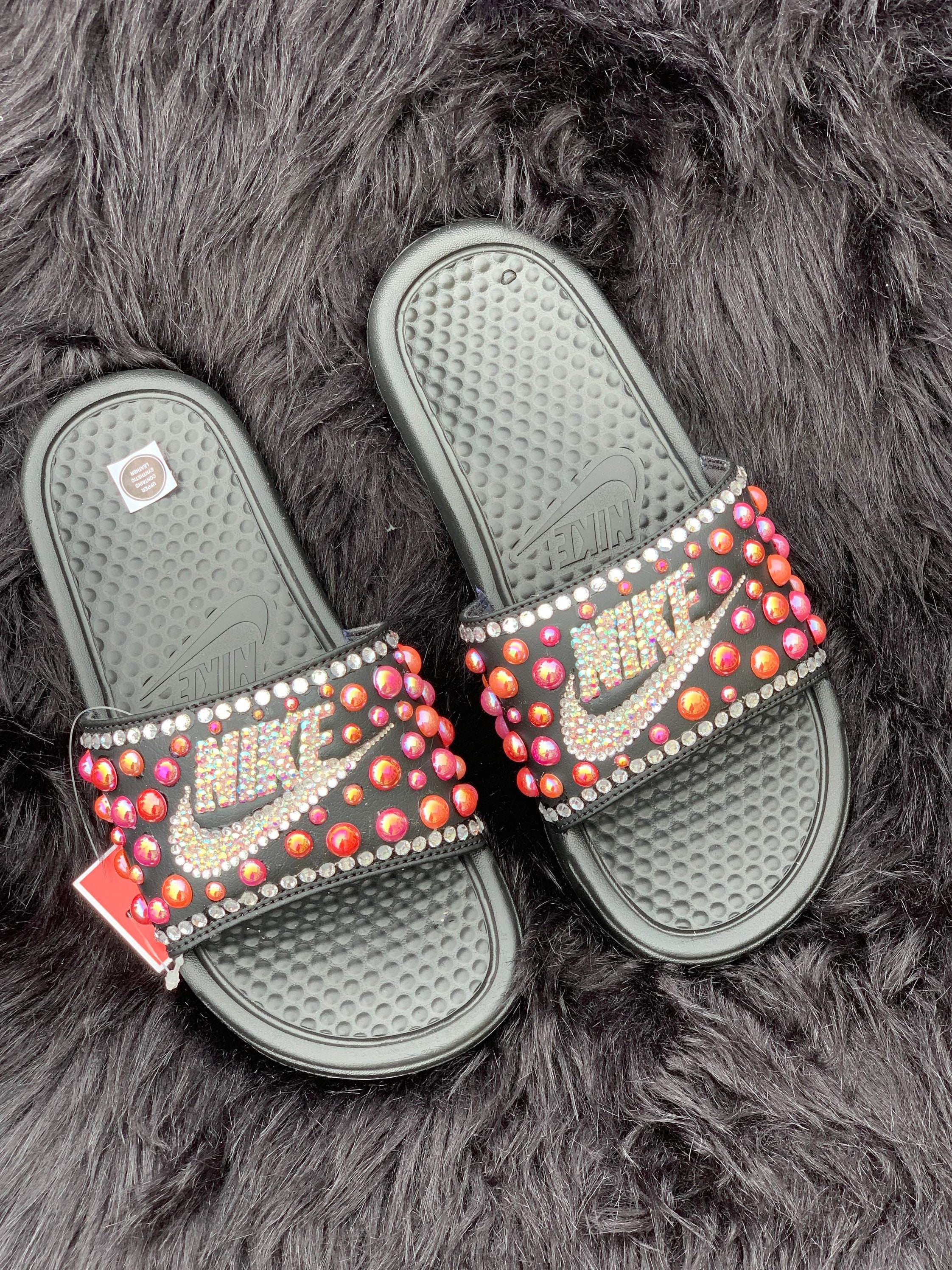 purple and gold nike slides