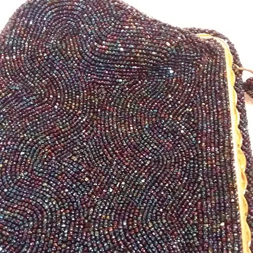 Saks Fifth Avenue shops beaded evening bag