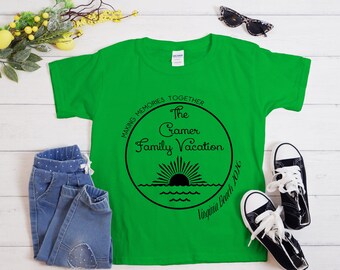 May include: A bright green t-shirt with a black circular graphic that reads "Making Memories Together The Cramer Family Vacation Virginia Beach 2026" with a sun and water design. The shirt is paired with blue jeans and black and white sneakers.