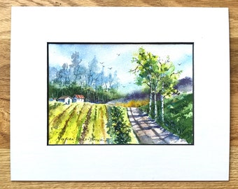 May include: Watercolor painting of a country road leading through a field with a small white house and a line of trees in the background. The road is lined with trees and the sky is a light blue.