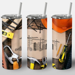 May include: Three stainless steel tumblers with a construction theme. The tumblers feature a brown wooden background with tools, a hard hat, and a blueprint of a building with cranes.