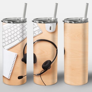 May include: Three stainless steel tumblers with a wood grain design. The tumbler on the left has a white keyboard, a notebook, and a headset with a microphone. The tumbler in the middle has a white keyboard, a computer mouse, and a headset with a microphone. The tumbler on the right is blank.