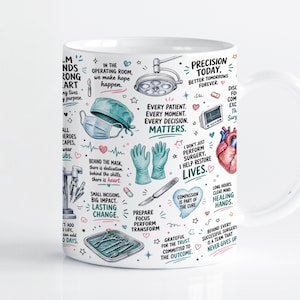 May include: A white ceramic mug featuring a colourful collage of medical illustrations including a surgical light, a heart, gloves, a mask, and surgical tools, interspersed with motivational text about surgery and patient care in black and teal.