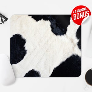 May include: Black and white cowhide pattern mousepad. The mousepad features a close-up of a cowhide with black and white patches.