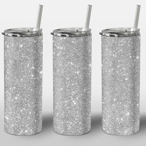 May include: Three silver glitter stainless steel tumblers with clear lids and straws.