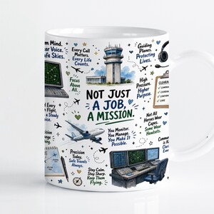 May include: A white ceramic mug featuring colorful illustrations of an air traffic control tower, airplanes, radar screens, and a headset. The text reads: Not Just A Job, A Mission, along with various phrases about aviation and air traffic control.