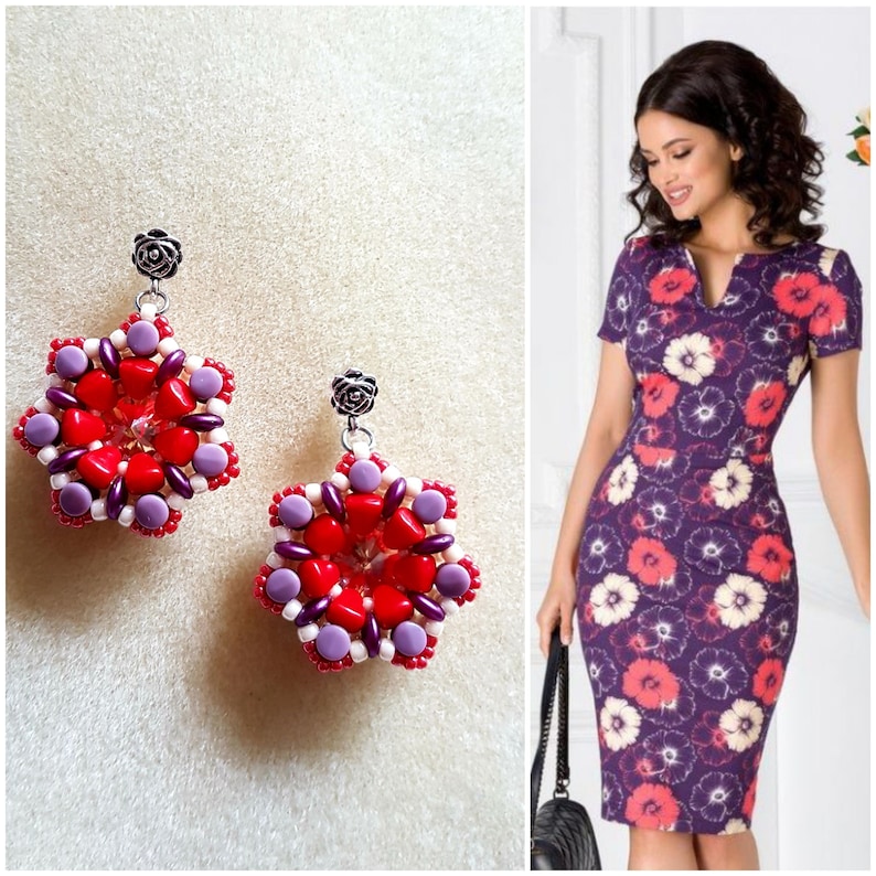 May include: A pair of red, white, and purple beaded earrings with a silver rose charm. The earrings are shaped like a star.