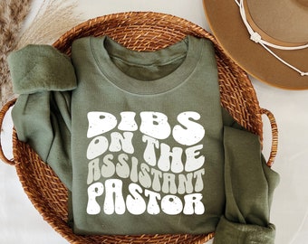 Dibs on the assistant pastor , Christian faith based apparel trendy Christian crewneck sweatshirt