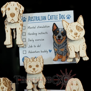 May include: Wooden dog cutouts, including a Dalmatian, Australian Cattle Dog, and Yorkshire Terrier, are displayed with a checklist titled "Australian Cattle Dog." The checklist includes "Mental stimulation," "Herding instincts," and "Daily exercise."