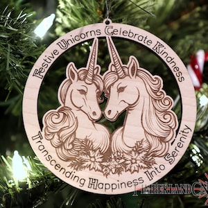 May include: A wooden Christmas ornament featuring two unicorns with a floral design and the text "Festive Unicorns Celebrate Kindness Transcending Happiness Into Serenity".