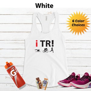 May include: White racerback tank top with "i TR!" text and triathlon symbols. Includes a red and orange water bottle, two energy gel packets, and a pair of magenta running shoes. The image also shows a yellow burst with "6 Color Choices" text.