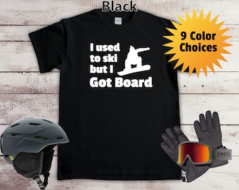 May include: Black t-shirt with white text that reads "I used to ski but I Got Board". A silhouette of a snowboarder is above the text. The shirt is available in 9 colors.