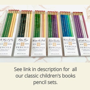 May include: A collection of pencil sets featuring quotes from classic children's books like "The Wizard of Oz" and "Peter Pan." Each set includes six unsharpened #2 wood pencils with quotes printed on them. The pencils have various colors and are packaged in white boxes.