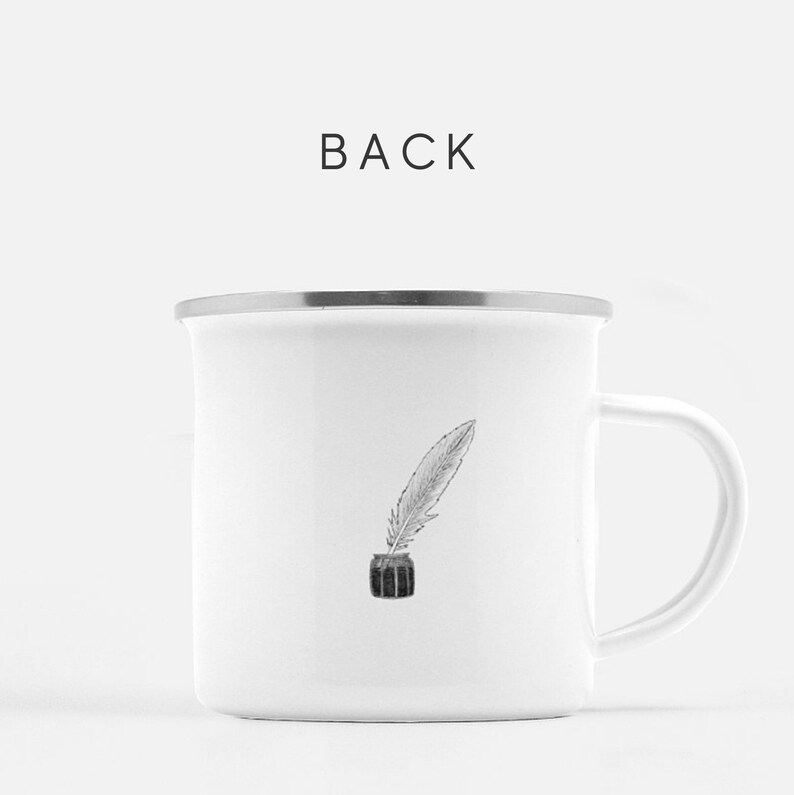May include: White enamel mug with a black and white illustration of a quill pen in an inkwell. The mug has a silver rim and handle. The back of the mug is shown.