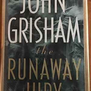 Assortment of John Grisham Hardback and Paperback Novels