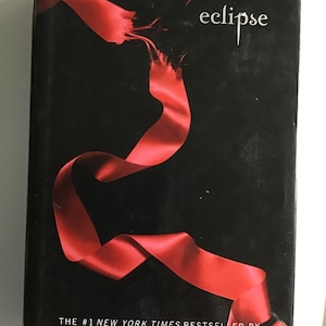 Assortment of Stephenie Meyer Hardback and Large Paperback Novels