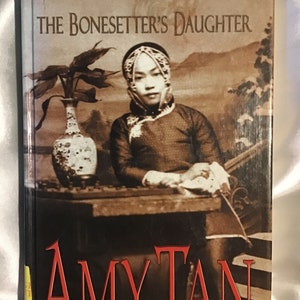 Assortment of Amy Tan Hardback and Large Paperback Novels