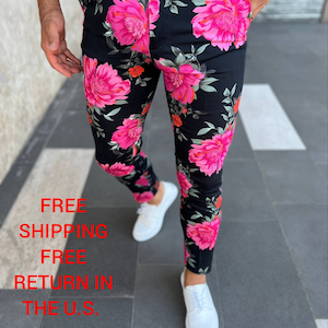 May include: Black pants with a pink floral print. The pants have a slim fit and are made of a lightweight fabric.