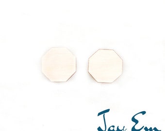 May include: Two octagonal wooden earrings, each measuring 12mm in diameter. The earrings are a light wood colour and have a smooth, polished finish.  Size in picture: 12mm. Jay Em Laser Designs.