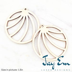 May include: Two laser-cut wooden round ornaments with a fan-like design. Each ornament has a small hole at the top for hanging. The size in the picture is 1.5 inches. The ornaments are light-colored wood. The text "Jay Em LASER DESIGNS" is in the bottom right corner.