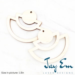 May include: Two unfinished wooden earrings with a geometric design. Each earring features three semi-circles, with a circle in the center. The earrings are 1.5 inches in size.  Jay Em Laser Designs.