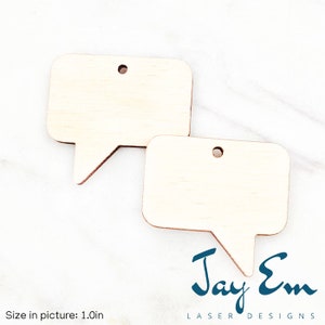 May include: Two unfinished wooden speech bubble shapes with a hole at the top for hanging. The shapes are approximately 1 inch in size.