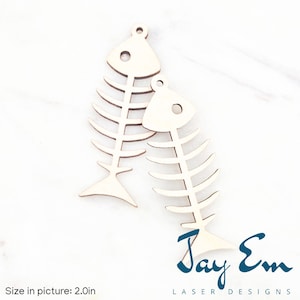 May include: Two unfinished wooden fish bone shapes, each with a hole at the top for hanging. The fish bones are approximately 2 inches in size.  Size in picture: 2.0in