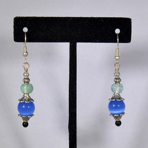 Silver earrings with green and blue beads