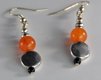 Silver earrings with orange and black beads